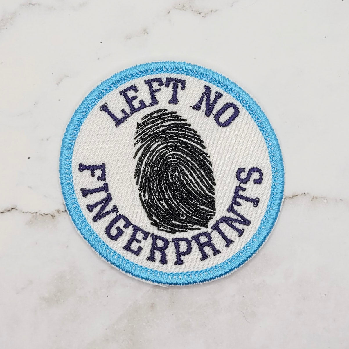 Left No Fingerprints Merit Badge