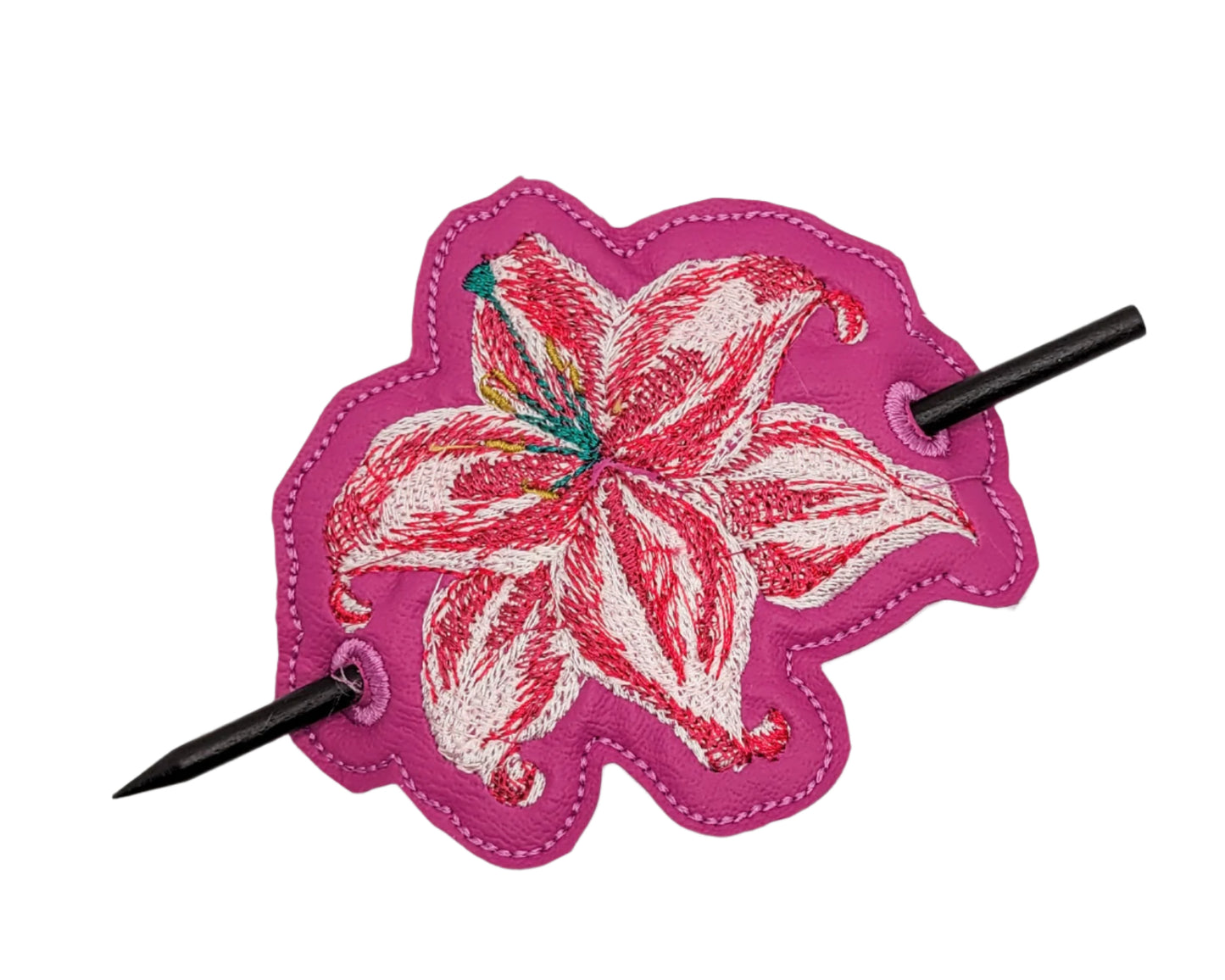 Floral hair clip with pink background on a white background
