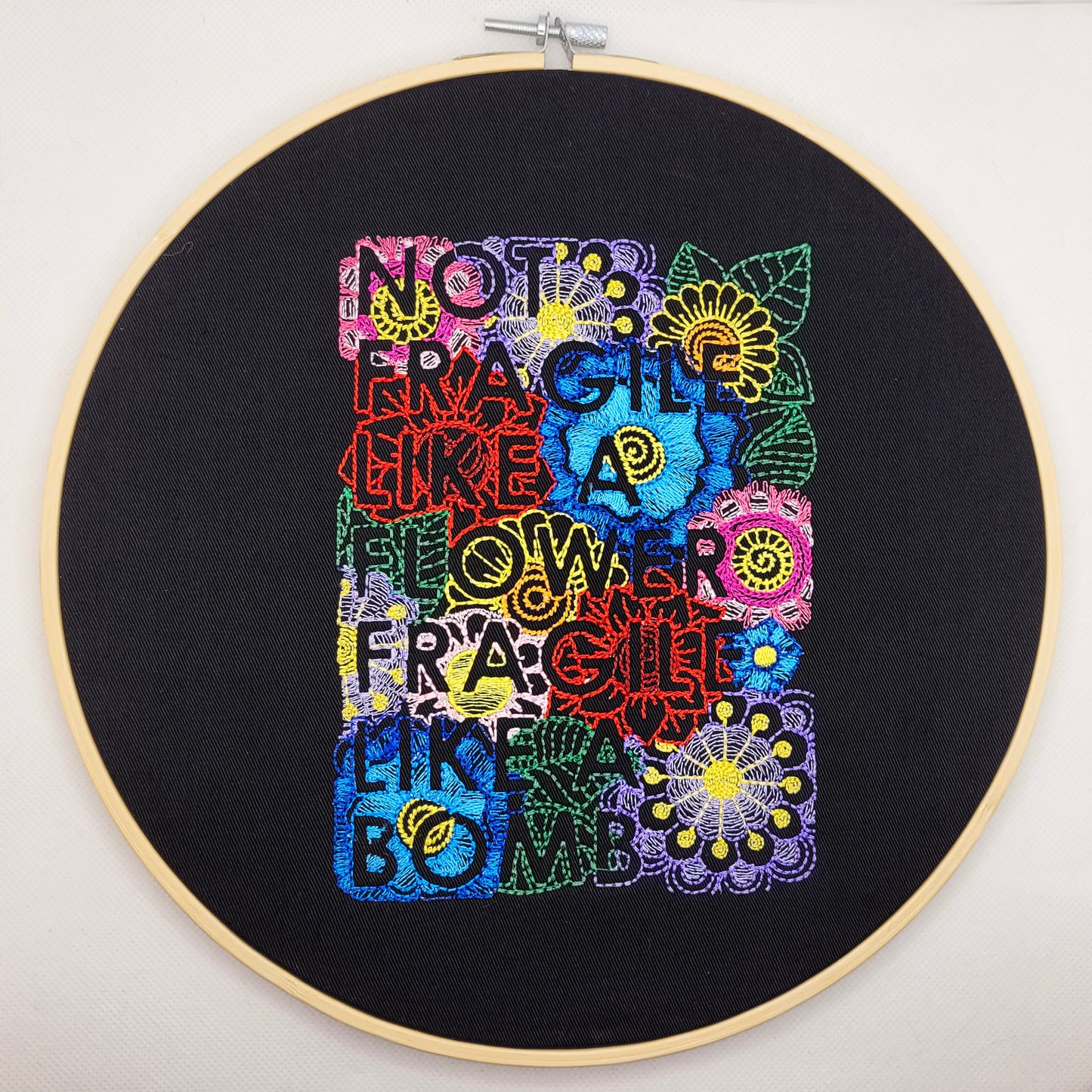 Not Fragile Like a Flower, Fragile Like a Bomb Embroidered Wall Hanging - 10" Hoop