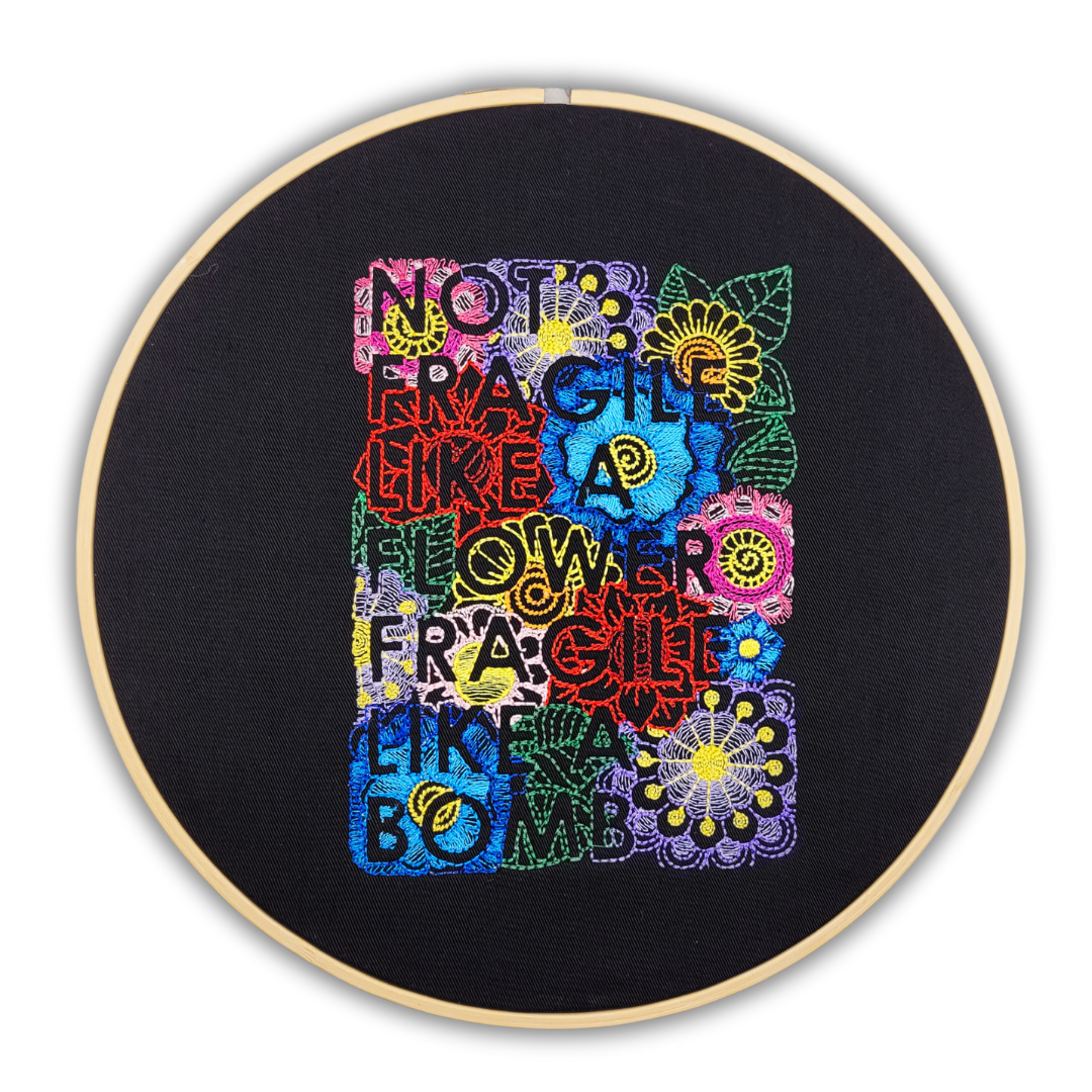 Not Fragile Like a Flower, Fragile Like a Bomb Embroidered Wall Hanging - 10" Hoop