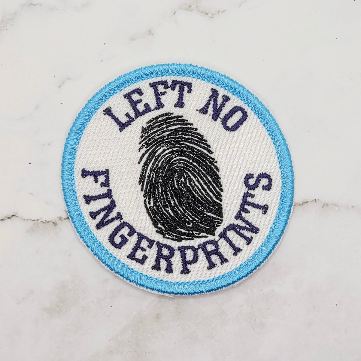 Left No Fingerprints Merit Badge