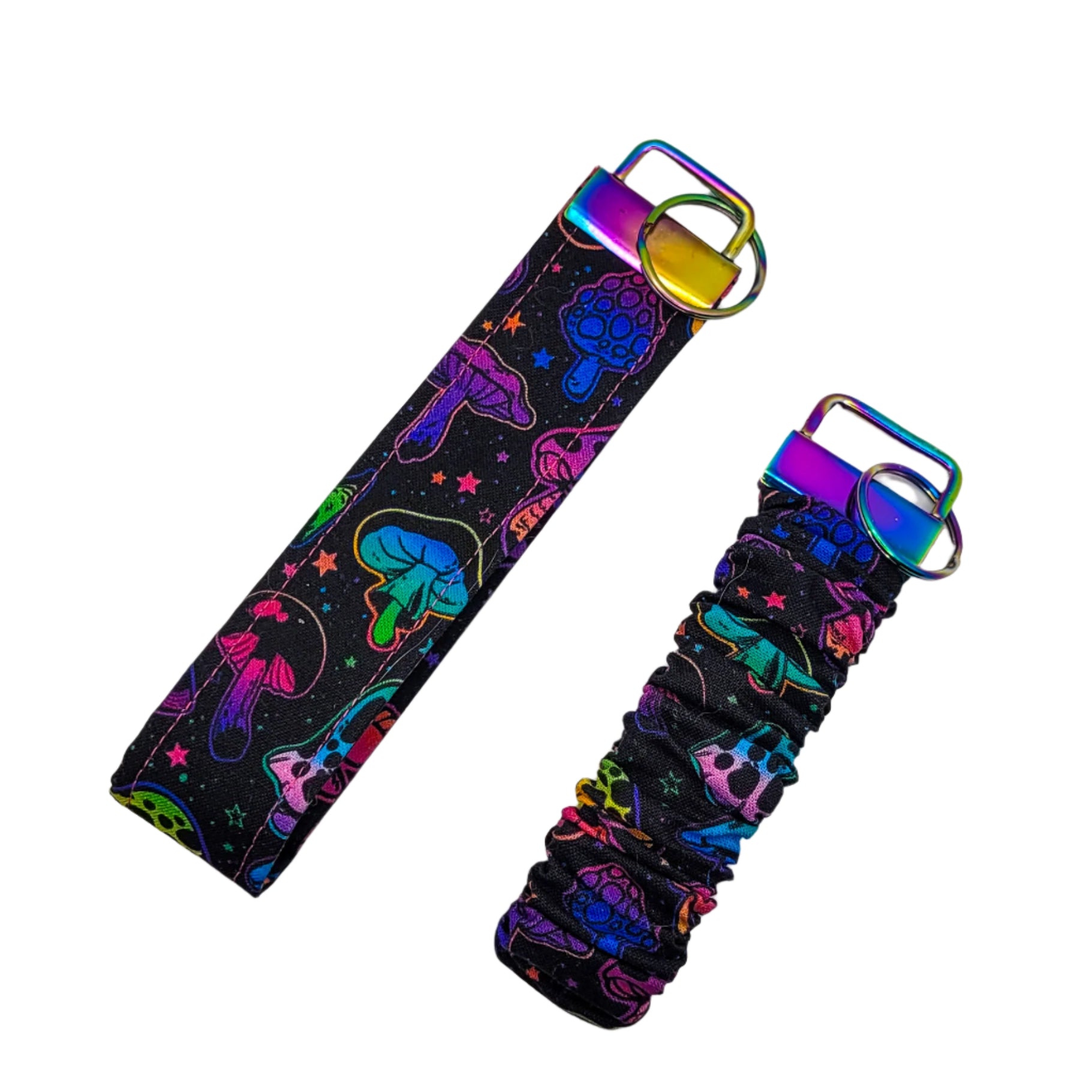 Keychain and scrunchie wristlet set with colourful designs on a light gray background