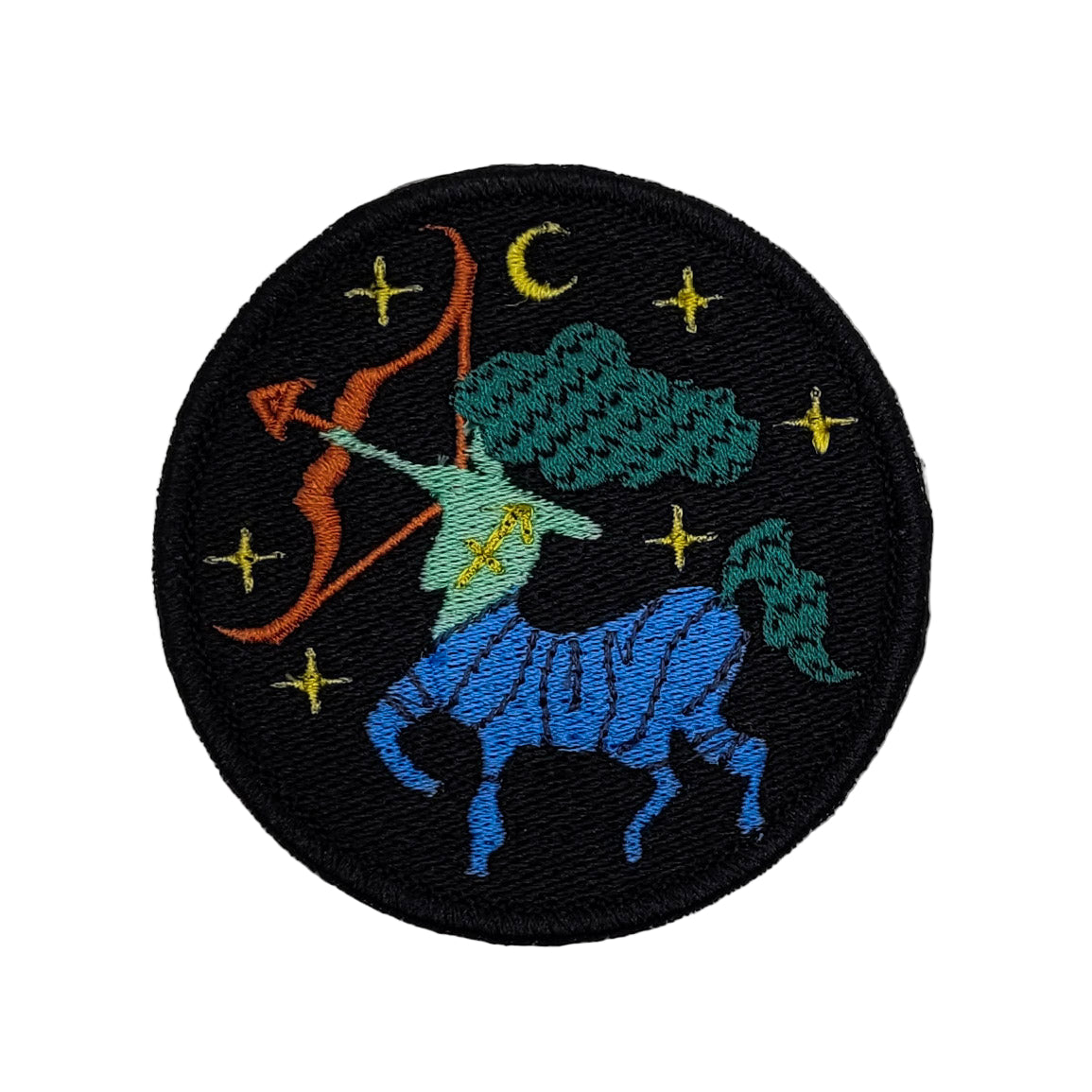 Embroidered patch of Sagittarius constellation on a black background