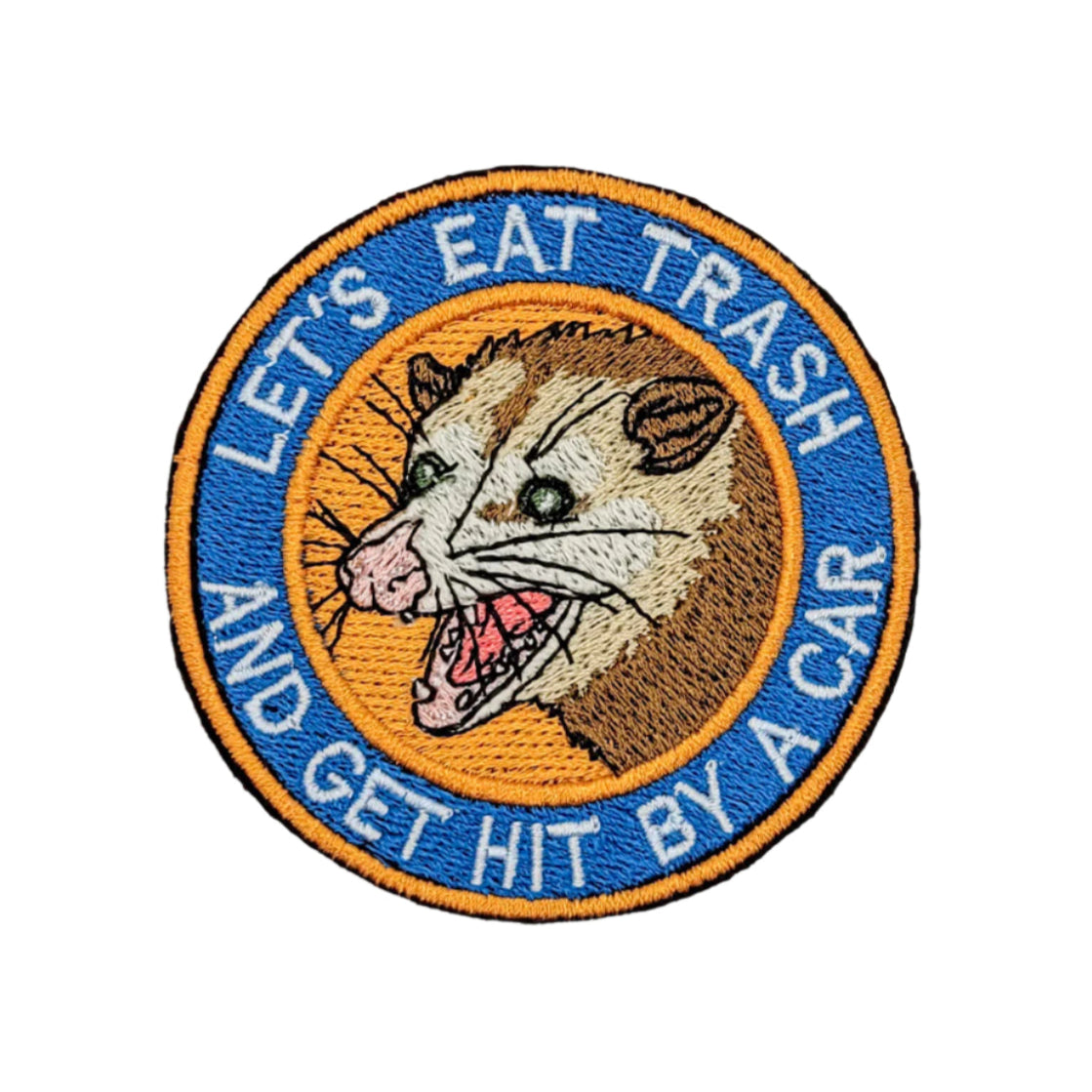 Patch with an opossum illustration and text 'Let's eat trash and get hit by a car' on a marble background
