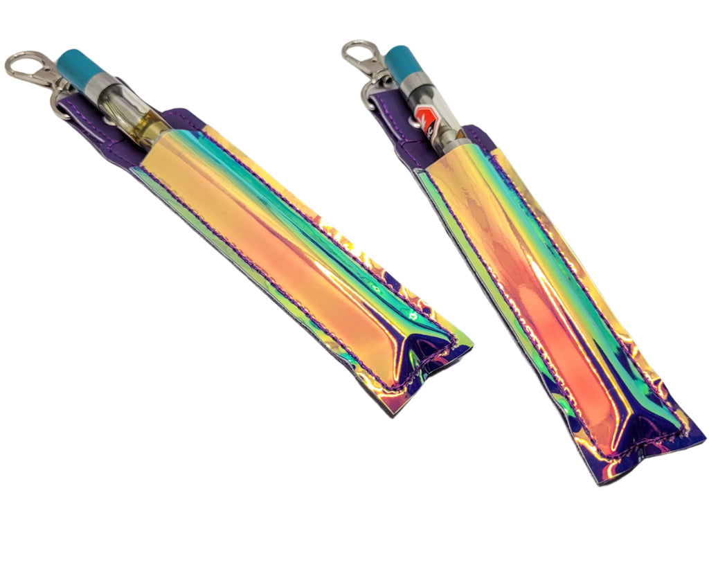 Two iridescent keychains on a marble surface