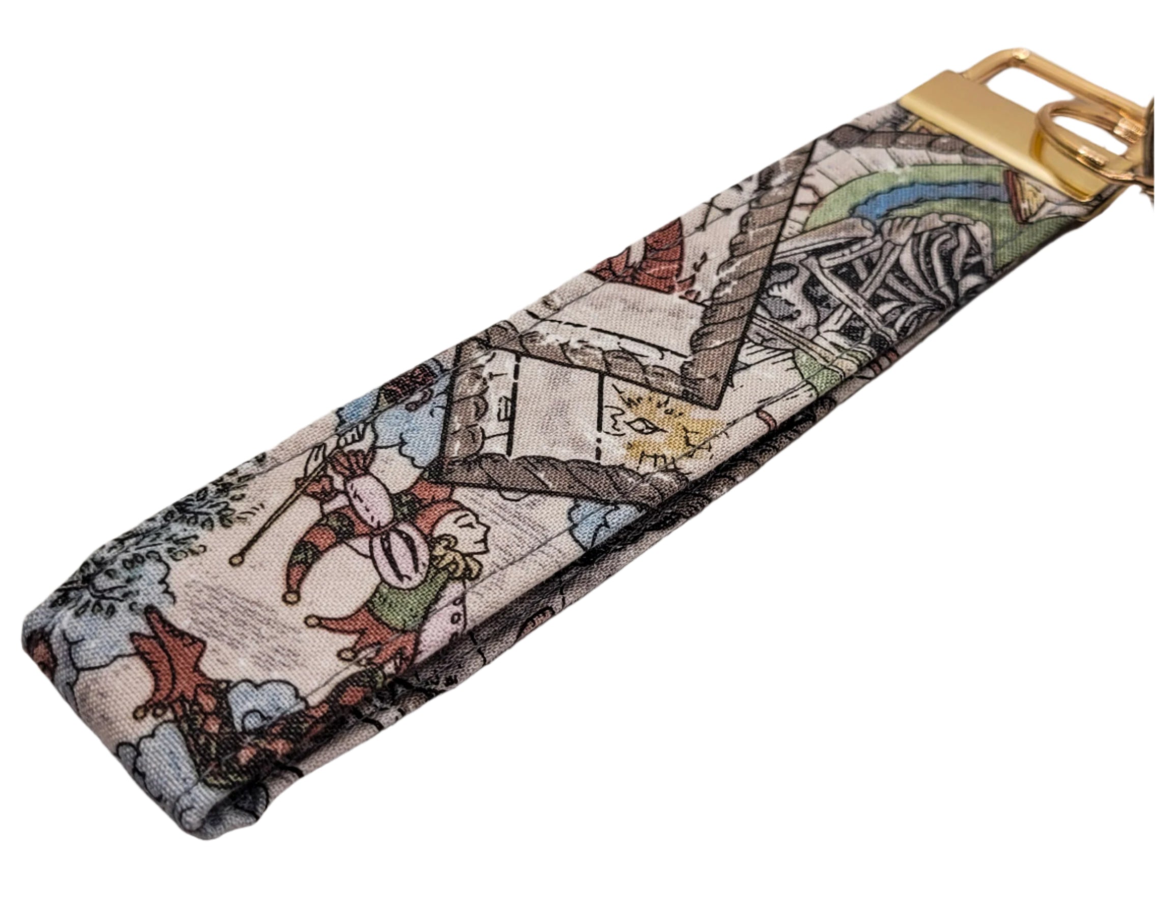 Fabric keychain with a tarot card design on a white background.