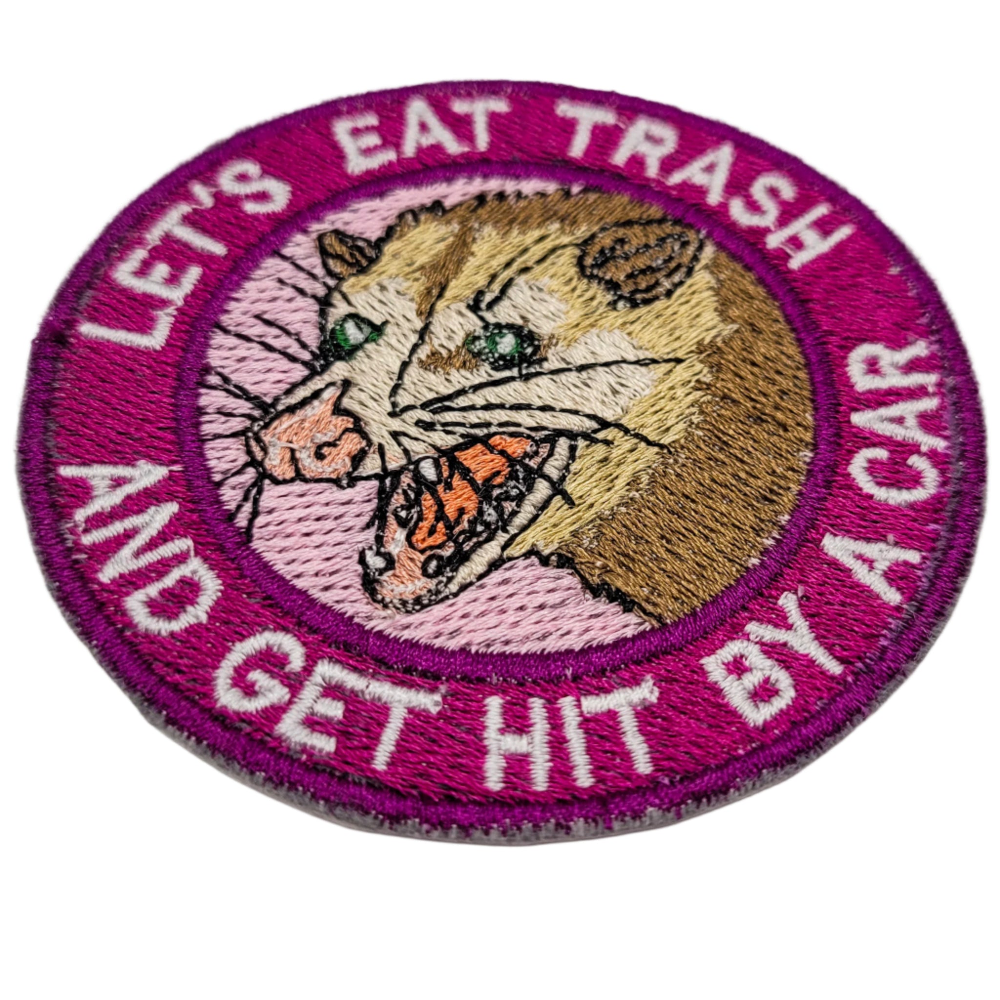 Embroidered patch with a possum illustration and text on a white background