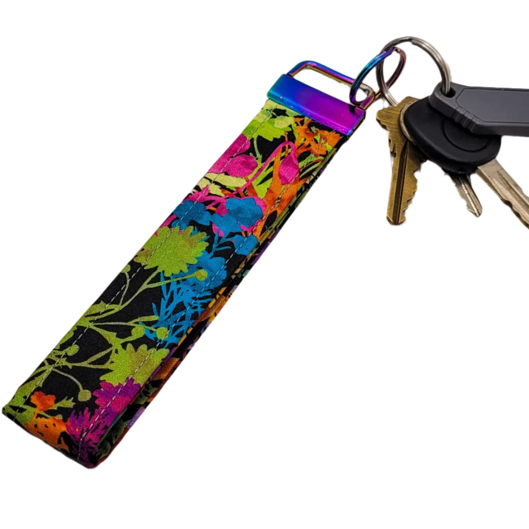 Colorful floral-patterned keychain with keys on a white background