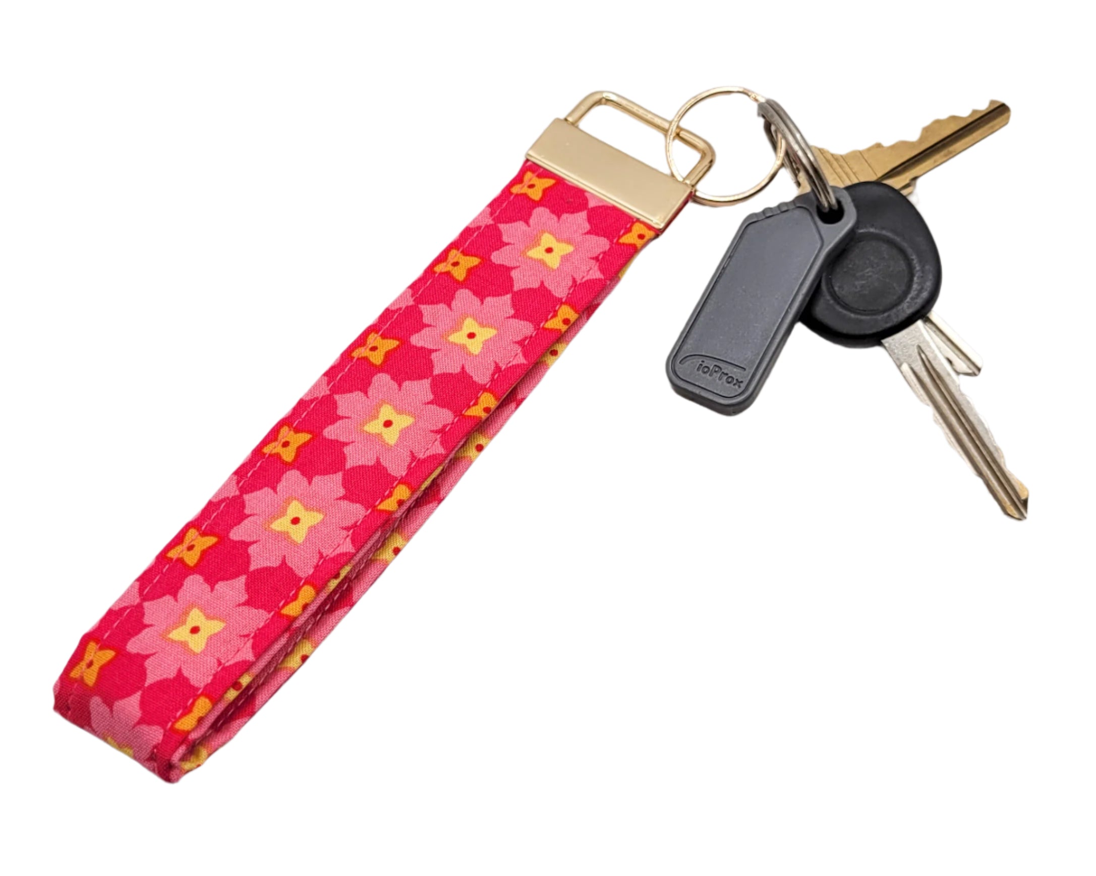 Keychain with floral pattern on a wooden surface