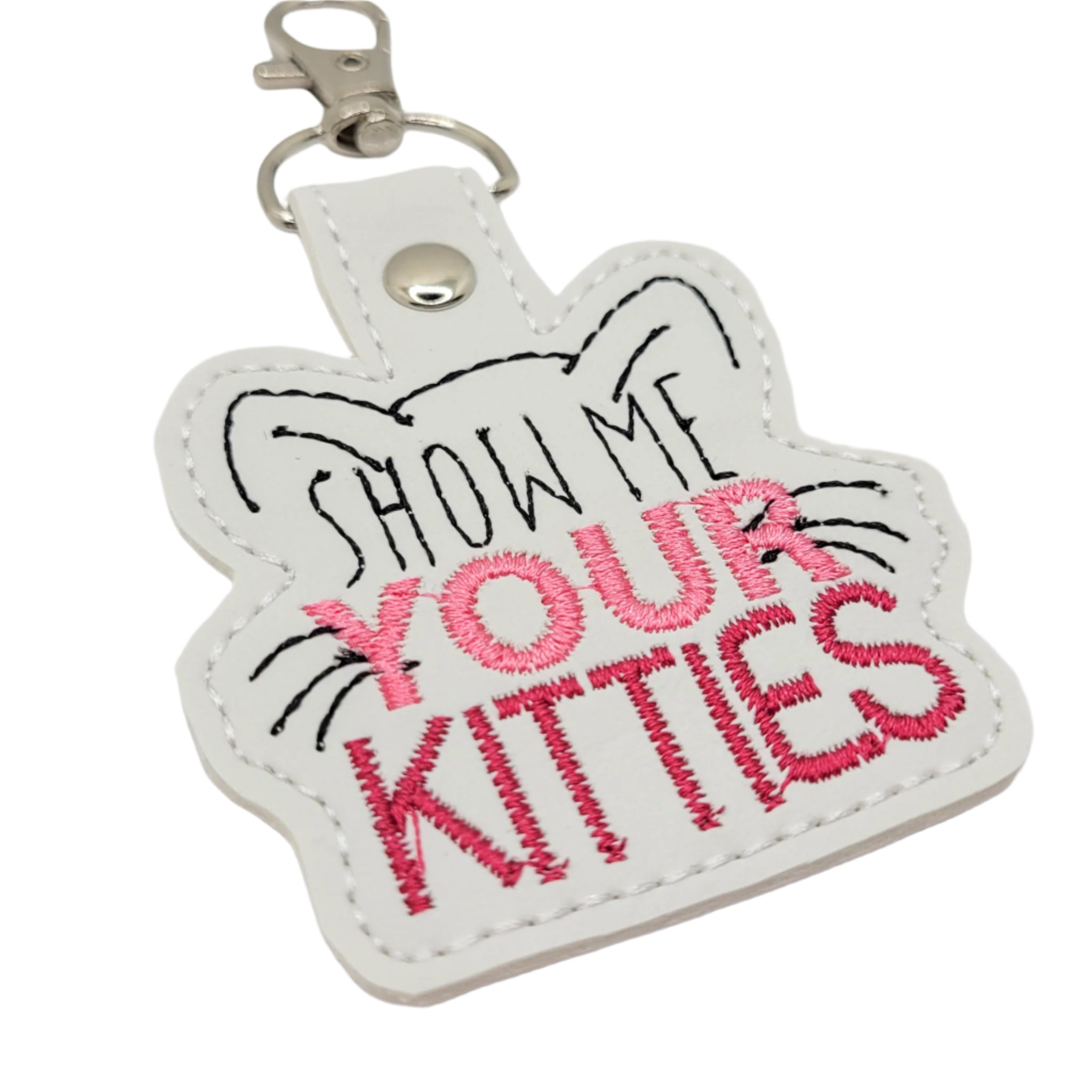 Keychain with 'Show Me Your Kitties' text on a white background
