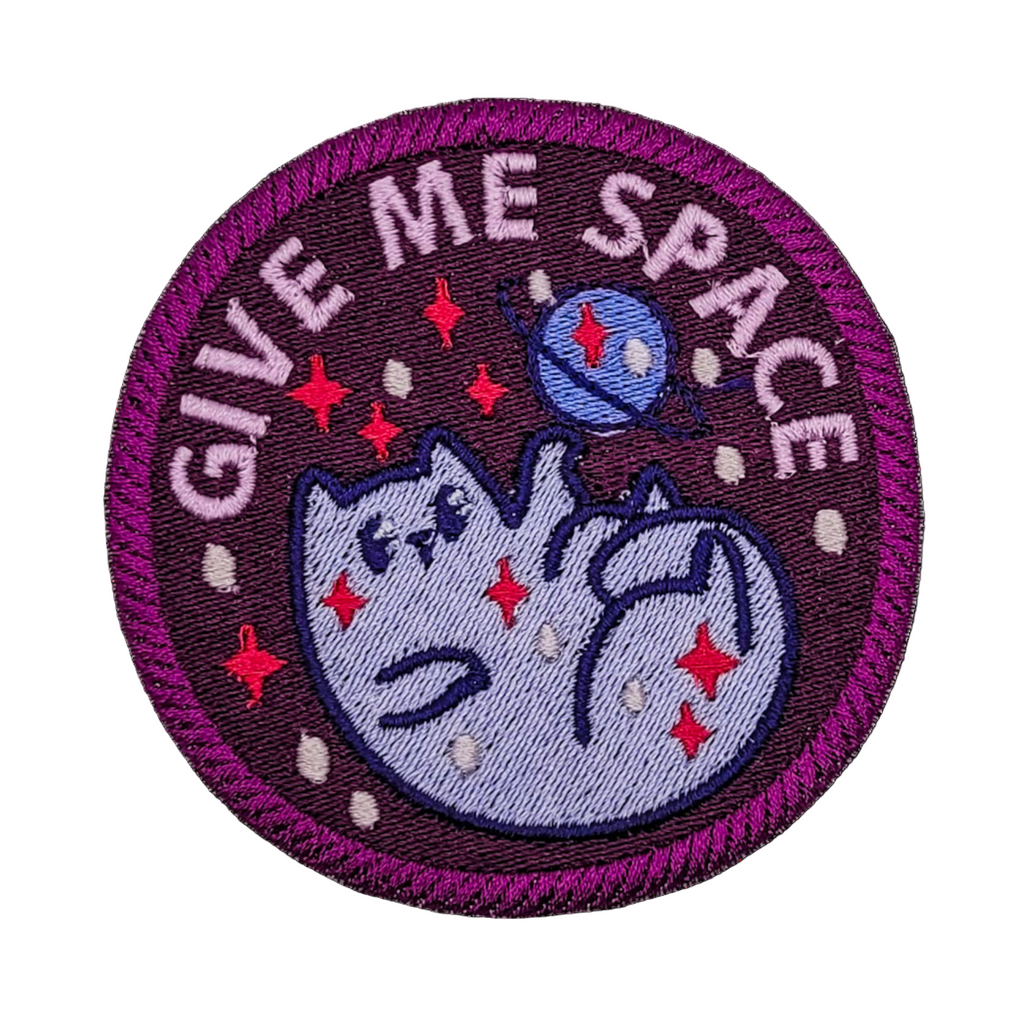 Circular patch with a cat and 'Give Me Space' text on a white background