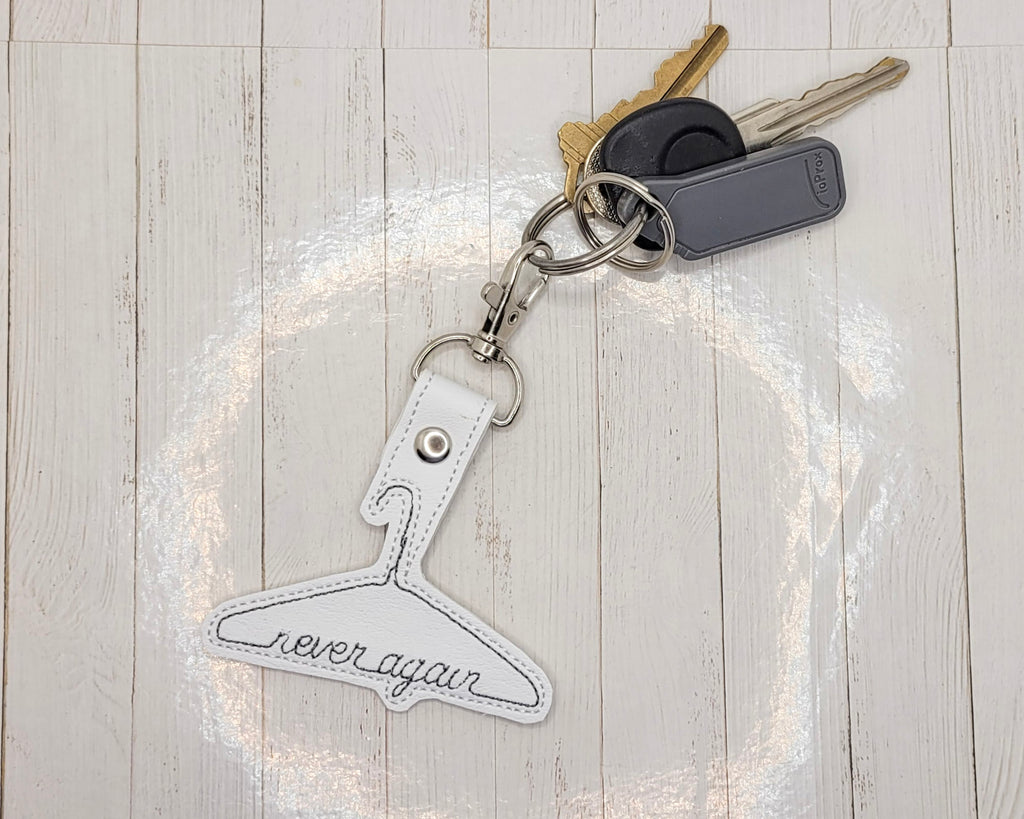 Porte-clés en métal « Plus jamais »