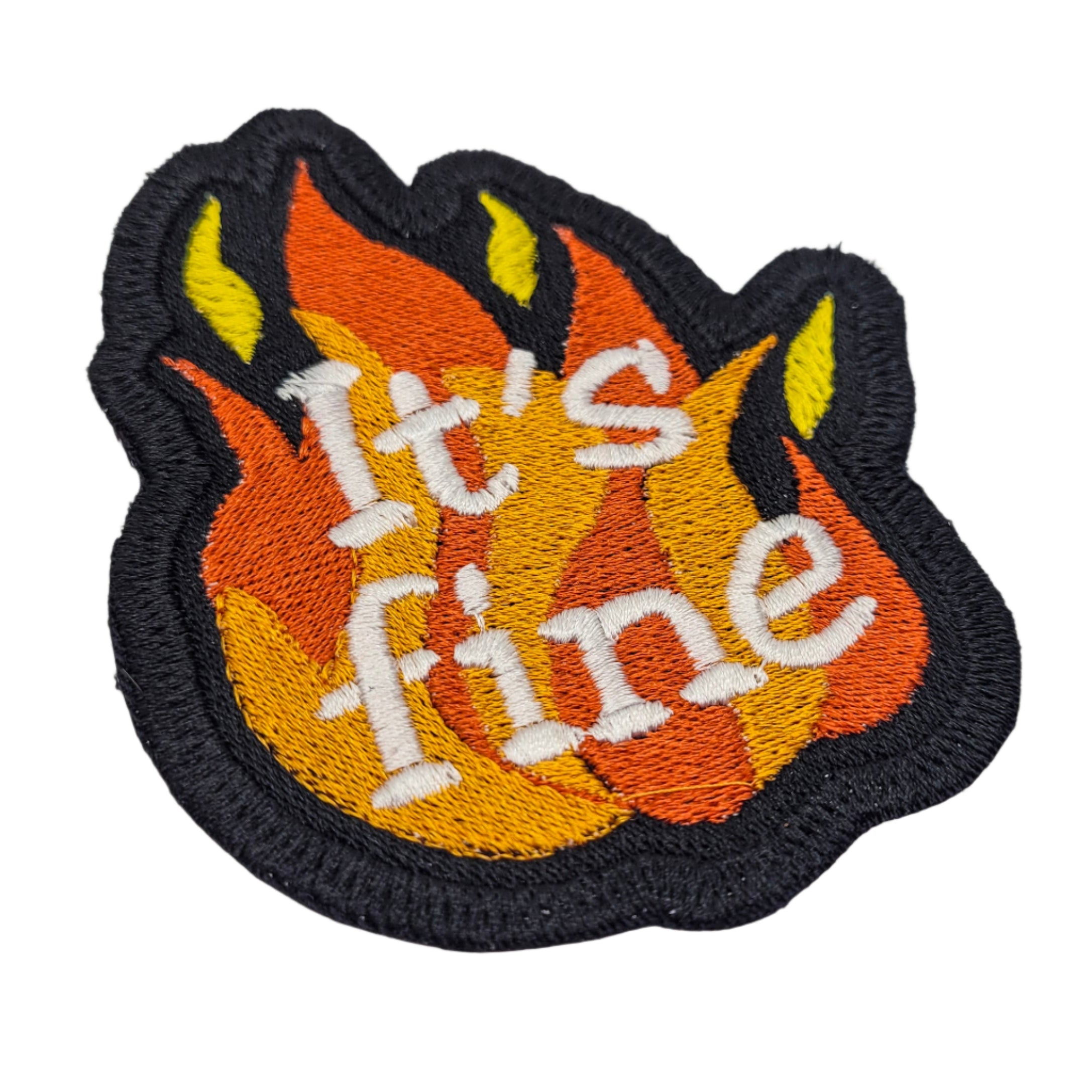 Embroidered patch with flames and 'It's fine' text on a white background.