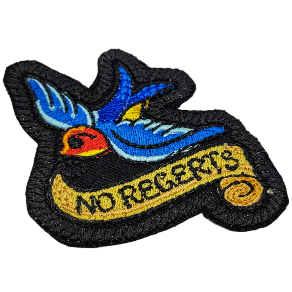 Embroidered patch with a bird design and 'No Regerts' text on a white background.